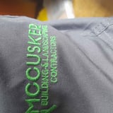 Company/TP logo - "Mc Cusker's Building & Landscaping Contracts"