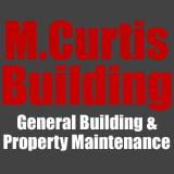 Company/TP logo - "M.Curtis Building"