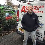 Company/TP logo - "Ambassador Roofing Specialist"