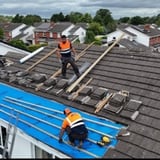 Company/TP logo - "JP CARROLL ROOFING AND BUILDING LTD"