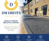 Company/TP logo - "DM Drives & Patios"