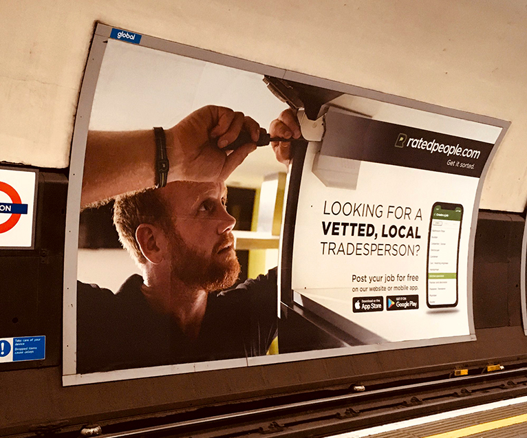 Shot of Rated People ad on the London Underground