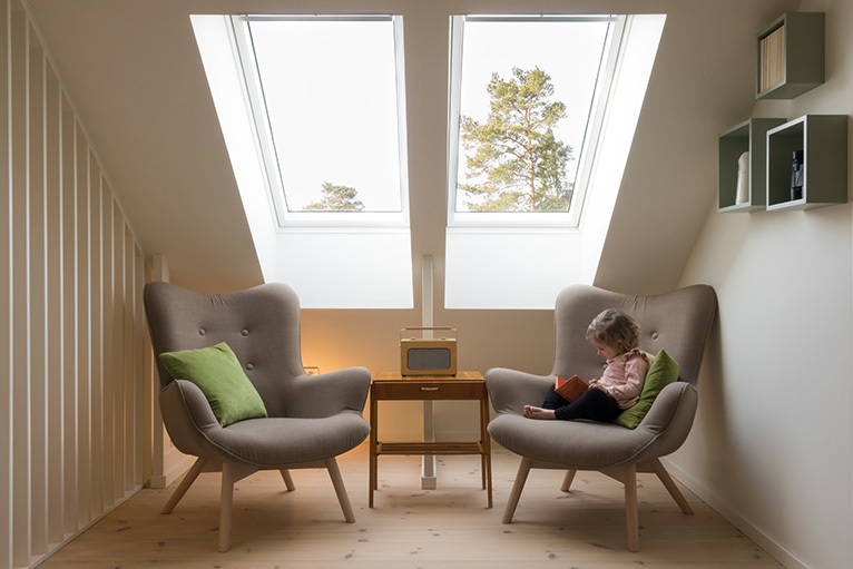 Two reading chairs under an eaves roof