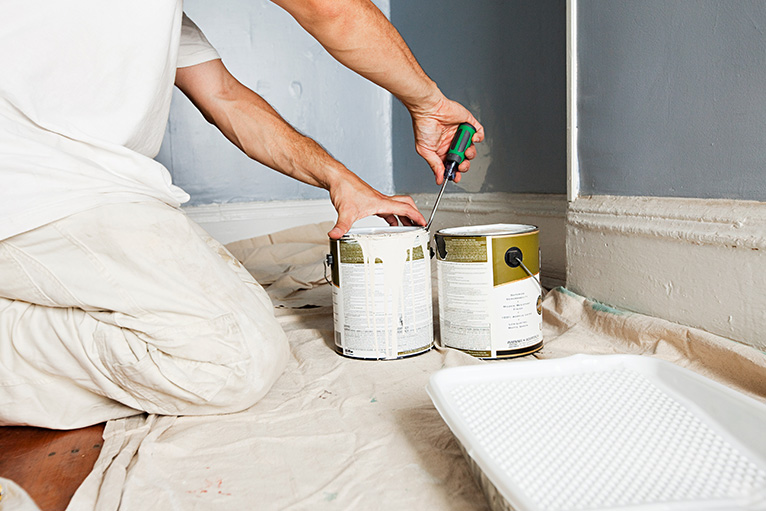 Paint cans being opened