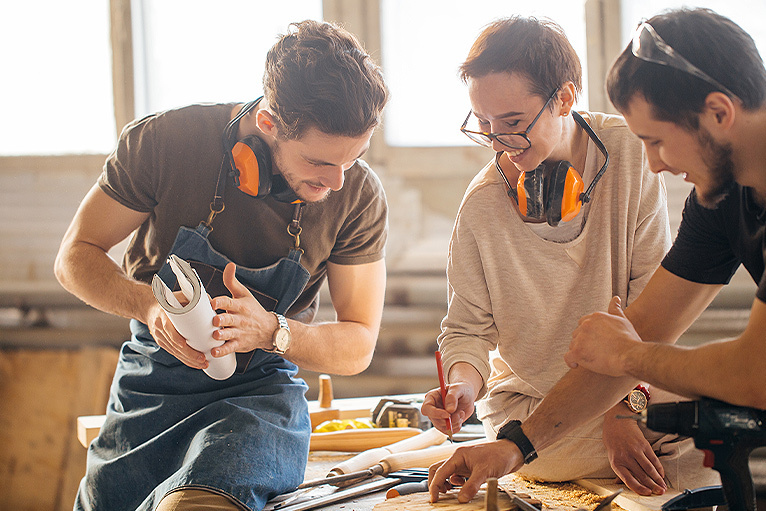 Smiling group of tradespeople talking