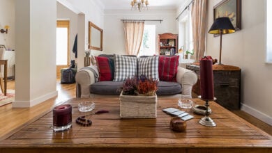 Cosy sofa with cushions in cottage living room