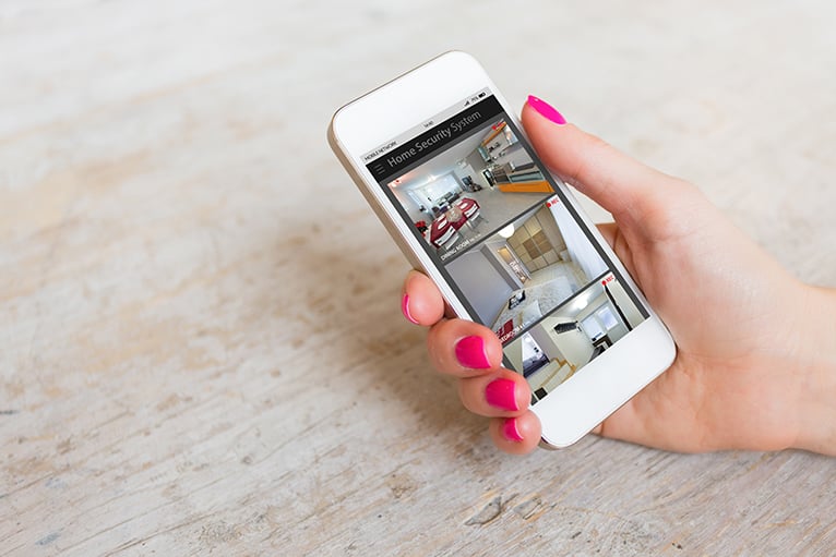 Home security system surveillance being watched on a smartphone