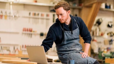Tradesperson using laptop in studio