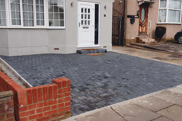 New, dark grey driveway in London, UK