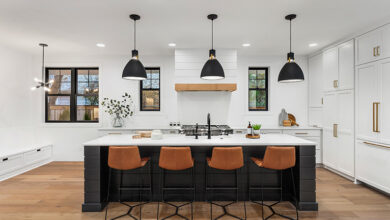 Ceiling mounted lights above island in modern farmhouse style luxury home