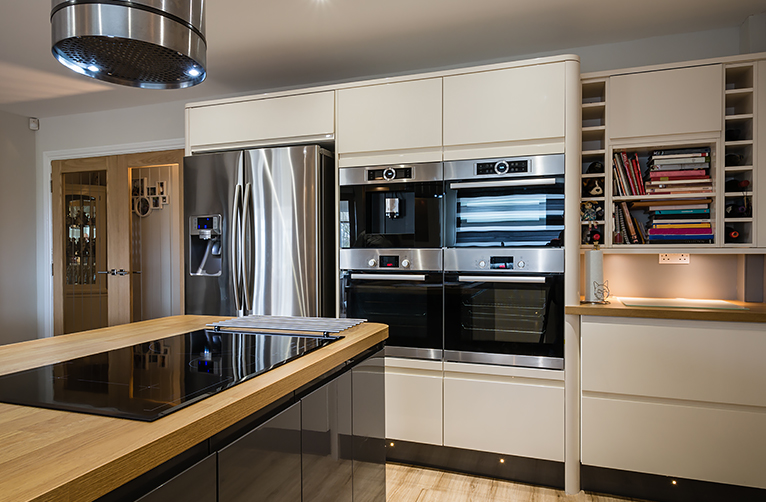 Kitchen with brand new ovens, fridge and induction hob
