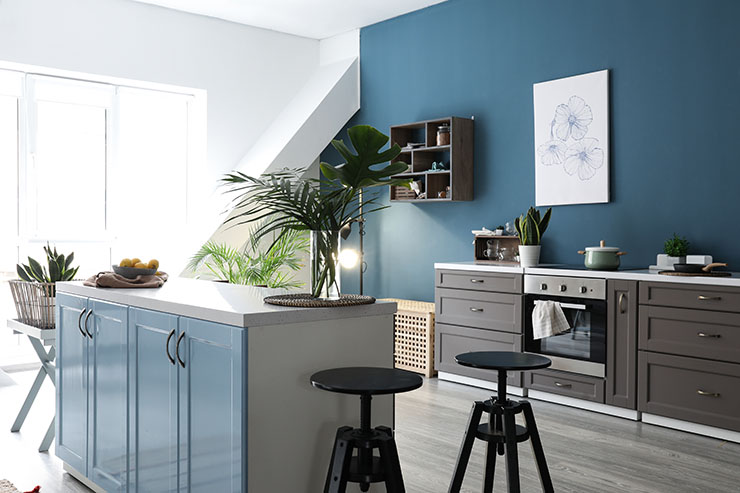 Image of a kitchen using dark colours and modern design