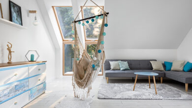 Picture of a loft conversion with a swinging chair and sofa