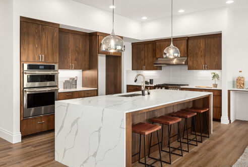 Picture of a marble kitchen with wooden cabinets