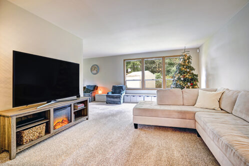 Picture of a TV room with L shaped sofa
