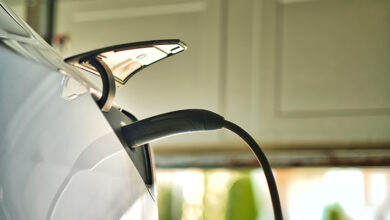 Picture of an electric vehicle getting charged from home charging point