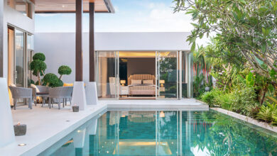 Picture of a house with an outdoor swimming pool