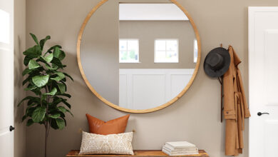 Picture of a round mirror on a wall