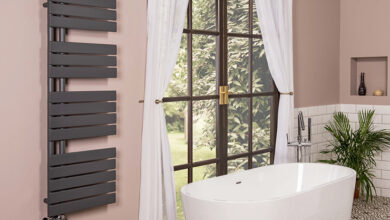 Picture of a bathroom with bathtub facing window
