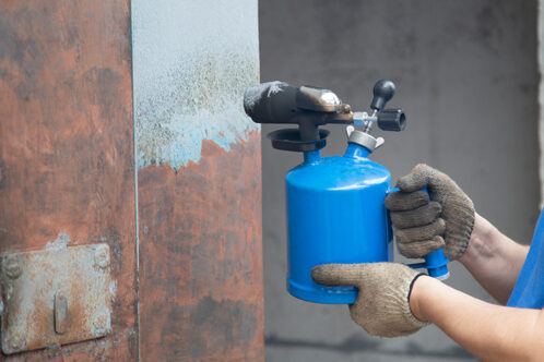 Picture of rust treatment being applied to a wall