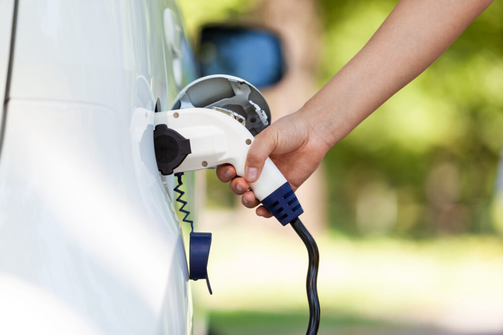 Picture of an EV charger charging a vehicle 