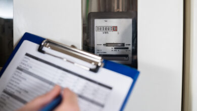 Picture of a clipboard over a meter during an electrical inspection