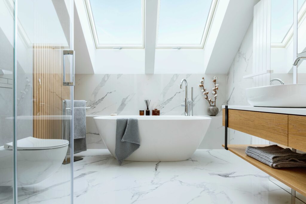 Picture of a bathroom with marble floors and skylight windows