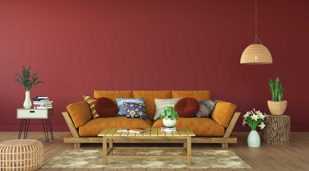 Picture of a living room with orange sofa and wine red walls