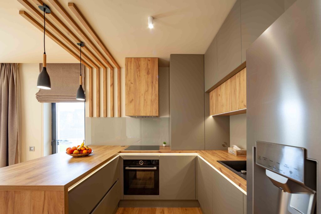 Picture of a kitchen with wooden worktops and modern pendant lighting fixtures