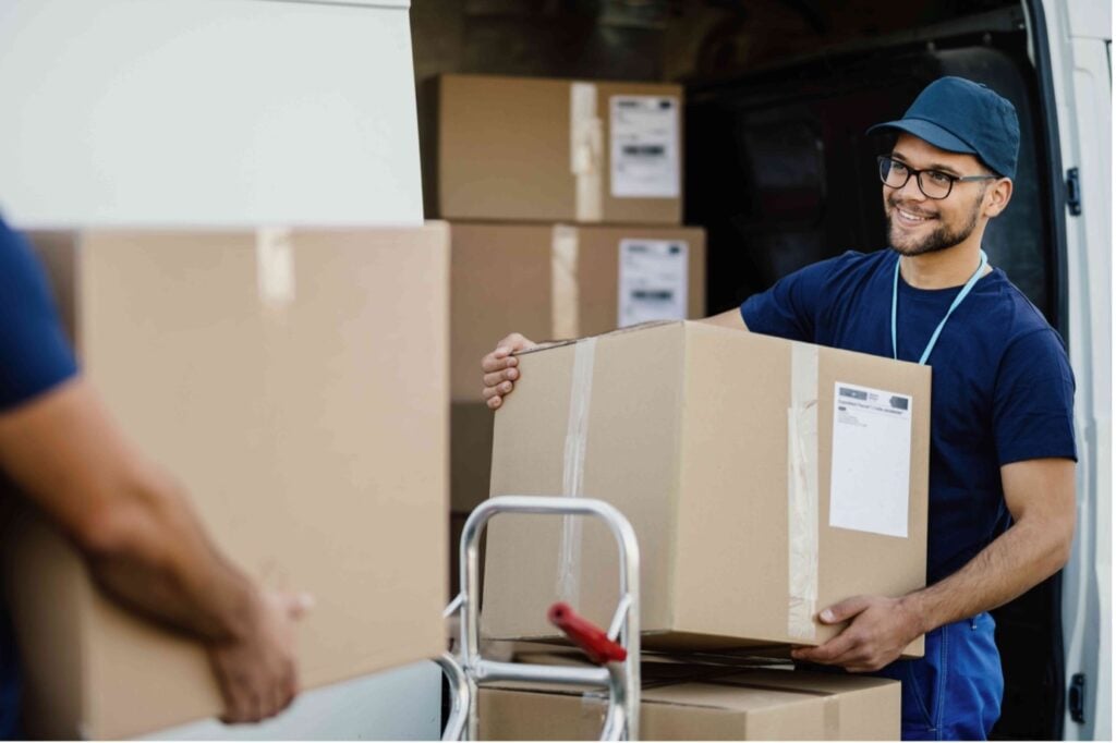 Picture of a moving specialist loading a box into a van