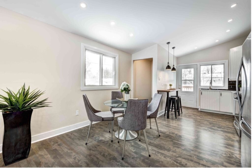 Picture of a garage conversion used as a modern kitchen with a dining area