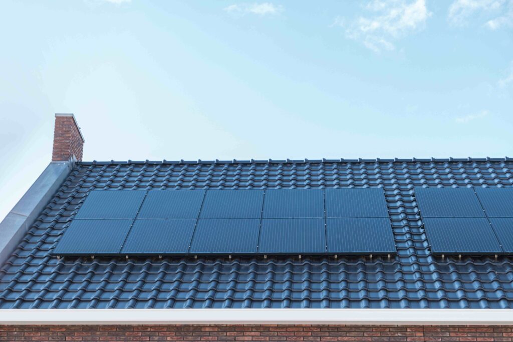 Picture of a roof with solar panels and blue sky